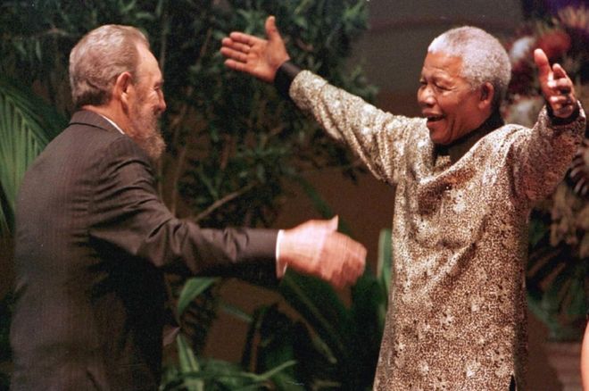 This photo taken on September 2, 1998 shows South African President Nelson Mandela greeting Cuban leader Fidel Castro as he arrives for the opening of the 12th Non-Aligned Movement summit in Durban, South Africa.